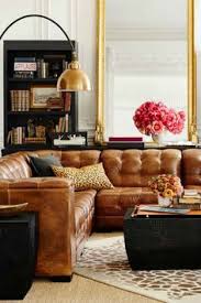 I am pretty obsessed with the camel leather sofa trend going on right now. Camel Leather