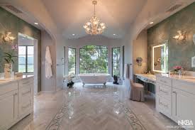 The dark wood trimmed mirror and cabinets combined with a glossy granite countertop adds class and elegance to this suite. Luxury Master Bath Nkba