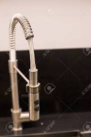 dark gray stone with chrome faucet