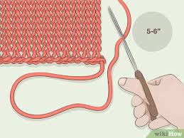 Thread a tapestry needle with the yarn tail, and run the yarn tail through the back loops of the stitches, working diagonally along the piece. 3 Ways To Weave In Ends When Knitting Wikihow