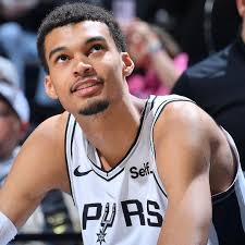 Victor Wembanyama convinced the San Antonio Spurs to hold tryouts for a fan  section at Frost Bank Arena. “It will be modeled after what he's seen from  soccer and basketball teams in