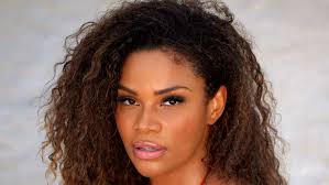 Kamie Crawford Is Pinstripe Perfection in Chic Gray Corpcore Set