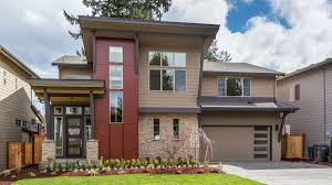 The first attached garages began appearing in the 1920s, and became more popular a decade later. Modern Two Story House Plan With An Attached Garage For Narrow Lot