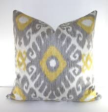 Pillows of this size work well alone and in pairs on sofas and loveseats. Ikat Decorative Throw Pillow Cover 18x18 Or 20x20 Inches Dove Grey Gold Yellow Ivory 45 00 Via Etsy
