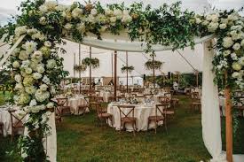 The customary structure of four poles and a covering can take on many different styles. Hanging Installations A Garden Party