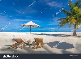 Tropical Beach Vacation And Holiday Concept Luxury Travel Banner Two Beach Chairs Umbrella Sea Sand S In 2020 Tropical Beach Vacations Beach Vacation Beach Scenery