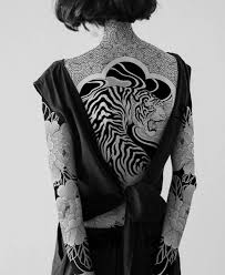 Blackout tattoos that cover large areas of the skin with black ink are winning the hearts of tattoo lovers around the globe. Pin By Juta Jano On Tattoo Full Body Tattoo Body Tattoos Girl Tattoos
