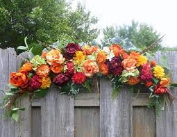 When purchasing your flowers, we suggest picking out your signature flower like the evening sun dinner plate and then add in filler flowers and greenery. Fall Wedding Arbor Wedding Arch Decorations Autumn Wedding Arch Julie Butler Creations
