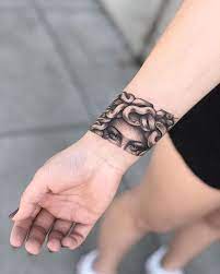 25 Medusa Tattoo Design Ideas With Meaning Entertainmentmesh Medusa Tattoo Medusa Tattoo Design Cuff Tattoo