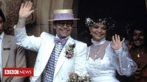 In 1983 elton john released the song kiss the bride, featuring lyrics such as i want to kiss the bride, yeah. a year later john was doing just that, kissing his new bride on the steps. Sir Elton John And Ex Wife Renate Blauel Resolve Legal Dispute Bbc News