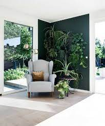 Accent Walls Are Cool Again Here S How To Get Them Right Dark Green Living Room Living Room Green Interior Design