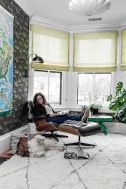 Wallpaper accent walls are a simple yet highly effective way to transform any room in your house. Bright Home Office With Bay Windows Features A Black Wallpaper Accent Wall And A Modern Armchair Hgtv