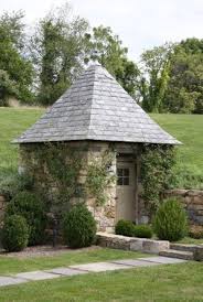 Stone Shed Plank Door With Strap Hinges Landscaping By Ajf Design Cabanon De Jardin Cabane Jardin Garden Shed