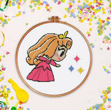 From bibs to booties to blankets, these colorful designs add life and laughter to baby's favorite belongings. Check Out This Item In My Etsy Shop Https Www Etsy Com Listing 637585513 Tiny Aurora Cross Sti Disney Cross Stitch Patterns Cross Stitch Nursery Cross Stitch