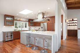 In order to accommodate regular chairs instead of stools or elevated bar chairs, islands are built with a lower top along one side and/or the end. Trends To Try Waterfall Countertops San Diego Home Garden Lifestyles