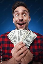 Handsome bearded man in red shirt. Funny guy is a lucky winner, she is  holding a