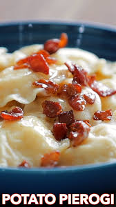 Pierogi Recipe Pierogirecipe Pierogi Filled With Cheesy Potatoes And Served With Crisp Bacon Melted Butter And Sour Cream Rezepte Pierogi Rezept Kochrezepte