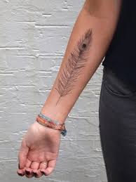 Black and white peacock tattoo. 22 Women Peacock Feather Tattoo Ideas To Try Styleoholic