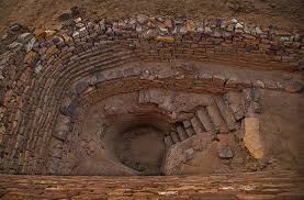 The harappans arranged and set pieces of gypsum to form ten large symbols or letters on a big wooden board. Dholavira