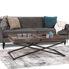 Round tables often require more space than rectangular ones, as they are perceived as being bigger. Wyndenhall Poulton Solid Aged Elm Wood And Metal 50 Inch Wide Rectangle Modern Industrial Coffee Table In Distressed Natural Elm Overstock 20684930