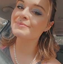 Who specializes in curly hair care in Traverse City?