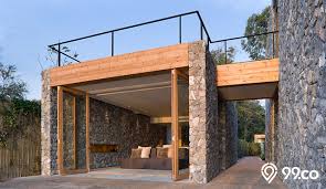 Teras rumah sebagai area penghubung antara rumah dengan dunia luar. 18 Inspirasi Desain Rumah Batu Alam Terlihat Natural Modern