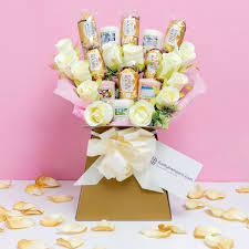 Please note that all of our chocolates are intact in their original wrappers and we do not skewer any. Yankee Candle And Ferrero Rocher Bouquet Funky Hampers