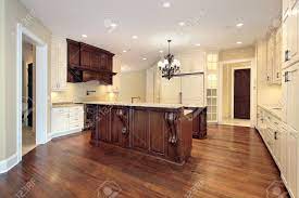 As one of the most common materials for kitchen islands, wood is a versatile choice that works well in both traditional and contemporary spaces. Kitchen In Luxury Home With Wood Paneling And Marble Island Stock Photo Picture And Royalty Free Image Image 6733435