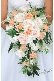 Fall is a season about celebrating natural beauty, and a fall wedding is an opportunity to do the same. Peach Rustic Theme Wedding Brides Bouquet With No Roses Peach Wedding Flowers Cascading Wedding Bouquets Coral Bouquet Wedding