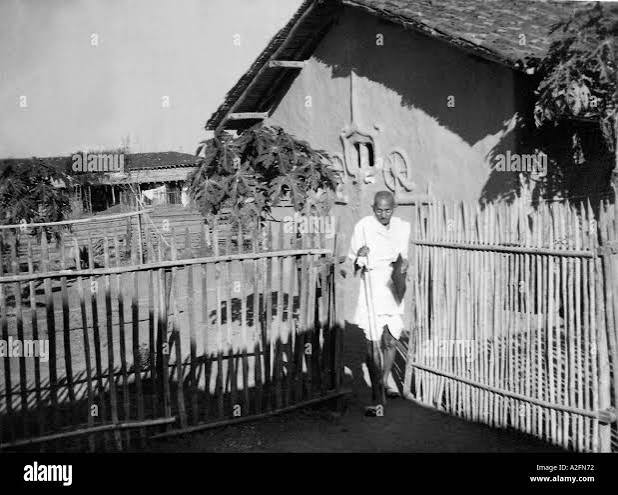 Mahatma Gandhi in front of his hut in Sevagram Ashram at Wardha, Maharashtra, India, Asia, old vintage 1900s picture Stock Photo - Alamy