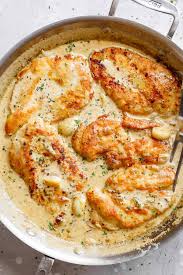 Canned soup, white wine, swiss cheese and crushed croutons dress up the chicken breasts in this elegant entree. Creamy Garlic Chicken Breasts Cafe Delites