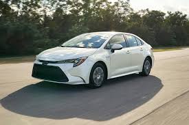 2020 toyota corolla hybrid interior design silver trim, piano black surrounds add class hybrid offers same interior room as standard model step inside the 2020 toyota corolla hybrid, and you'll find a simplified and streamlined cabin. 2020 Toyota Corolla Hybrid Pictures 110 Photos Edmunds