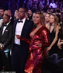 Beyoncé slays at the 2017 grammys. Pregnant Beyonce Squeezes Bump Into Tight Dress At Grammys Daily Mail Online