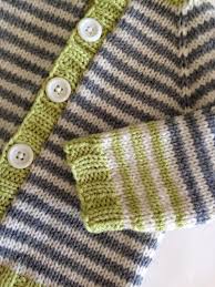 Free knitting pattern for a child's sweater/jumper with an intarsia train on the front. Knitionary Top Ten Free Baby Sweater Patterns