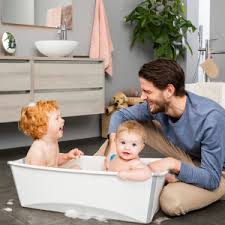 The only hard plastic baby bath which folds away flat with a simple touch of your hand. Amazon Com Stokke Flexi Bath Transparent Blue Foldable Baby Bathtub Lightweight Durable Easy To Store Convenient To Use At Home Or Traveling Best For Newborns Babies Up