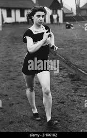 Quick March Champion -- Miss Irene McCormack of Sidcup Kent, Cambridge  Harriers, and W.A.A.A. international 1 mile walking champion, photographed  during training at Charlton Park. March 14, 1952. (Photo by Fox  Photos).;Quick