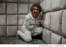 patient wearing straitjacket ...