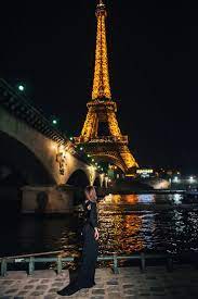 Night Photosession For A Girl In Paris With Parisphotographer Girl In Front Of The Eiffel Tower At Night With Bot Scenery Photography Paris Photos Tour Eiffel