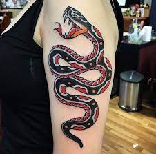 If you wish to have a traditional snake tattoo design then better make it aggressive because a cute and girly snake tattoo design was not. Sunset Tattoo Traditional Snake Tattoo Snake Tattoo Design Snake Tattoo