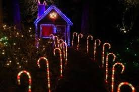 Fantasy house in a candy land. Candy Cane Garden Walkway Lighting Christmas House Lights Christmas Lights Outdoor Christmas Lights