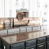 You can also add a peel and stick tin backsplash for a more rustic texture. 1