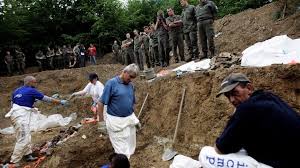 Forensic experts examine dozens of bodies in a mass grave near srebrenica, where victims of the massacre were buried credit: Bosnia S Srebrenica Massacre 25 Years On In Pictures Bbc News