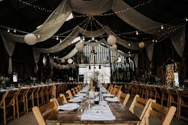 How many people does the barn seat? Deepdale Farm Wedding Magical Memorable Barn With Gin Decor Wedding Lights Barn Wedding Venue Farm Wedding