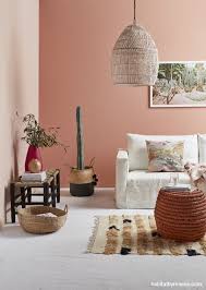 By Using Two Muted Sunset Pinks This Space Is Kept From Become Overpowering The Lighter Co Living Room Wall Color Feature Wall Living Room Living Room Colors
