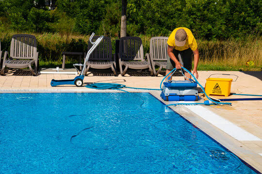 Residential swimming pool with clean blue water and a clear pool floor