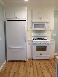 Finished Kitchen Natural Red Oak Floors Bm Simply White Inset Cabinets Bm Woodlawn Blue Walls Mobile Home Makeover Red Oak Floors Inset Cabinets