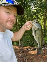 How much large mouth bass should be harvested from a 1.5 acre pond?