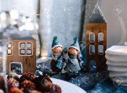 Maybe you would like to learn more about one of these? Porcelain Figurines Of Children In A Christmas Decor Winter Figurines Of A Boy And A Girl With Gifts On The Background Of Houses And Cones Christmas Greeting Card Stock Photo Picture And