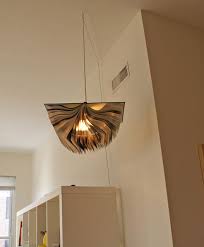 Light bulb wattages that exceed light fixture ratings pose a danger of overheating and fire. Abby Jesse S Artsy Live Work Apartment House Tour Diy Old Books Book Lamp Repurposed