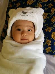 A group of American soldiers bow their heads as Chaplain 1st Lt. Harvey  Floyd Bell says grace prior to eating Christmas dinner near the Italian  front. Photo taken